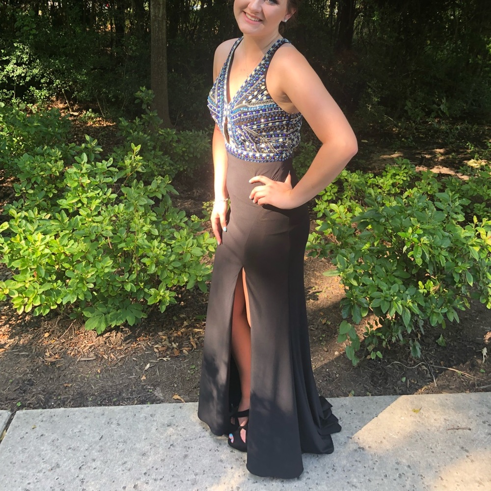 Prom dress worn one and dry cleaned after. Beautiful gem detailing!!